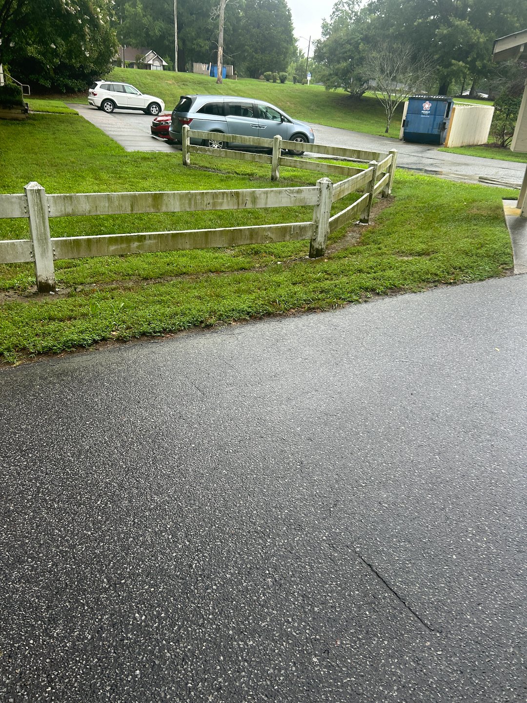 Quality Cleaning apartment complex Archdale. Pressure washing entrance fence and painting. 